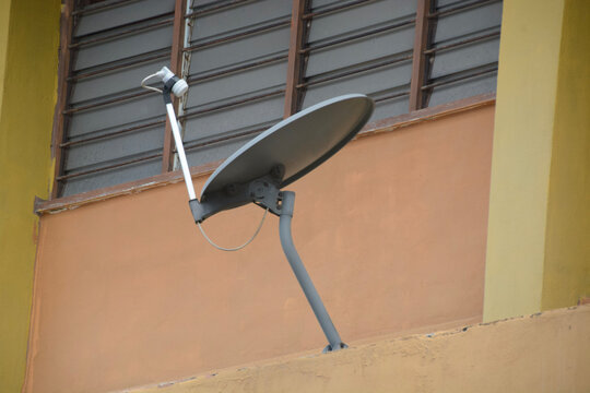 Satellite Dish Installed on Residential Building Exterior