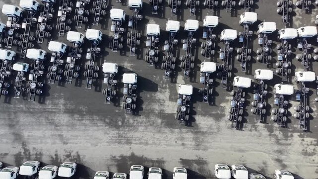 Aerial view of new truck chassis parked at a factory lot
