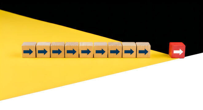 Wooden blocks with blue arrows pointing right in a row on a yellow surface, with a single red block with a white arrow pointing right, separated from the others