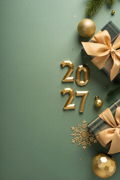 Festive green and gold Christmas flatlay with wrapped presents bows vertical ornaments and 2027 New Year celebration