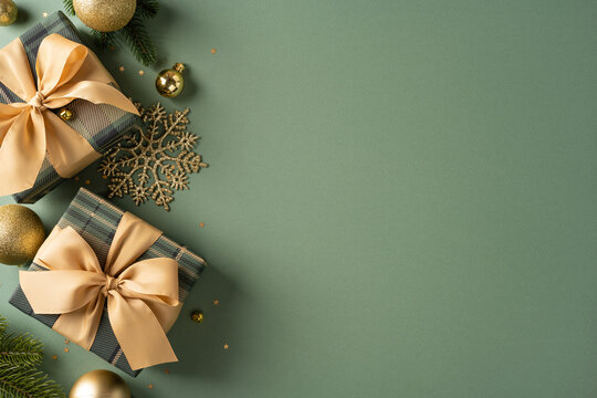 Merry Christmas and Happy New Year gifts with gold ribbons and ornaments on green background