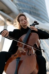 Fototapeta premium Elegant Cellist in Modern Space
