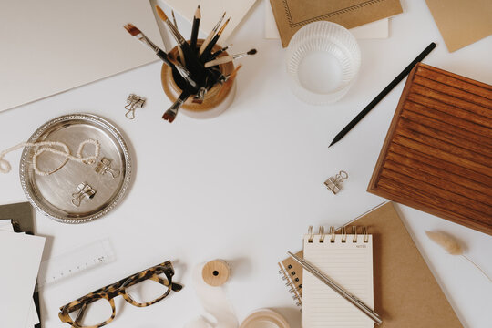 Cozy Creative Desk Frame With Kraft Notebooks And Brushes