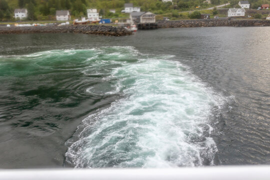 People, enjoying ferry ride between Bodo and Lofoten Moskenesoya summertime, child and adults on a ferry on sunset