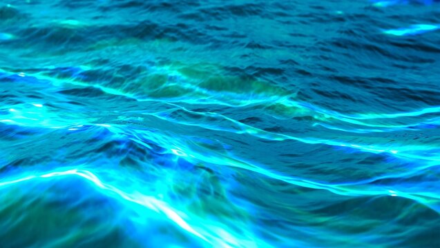 Abstract background of blue water surface with ripples and sunlight reflections