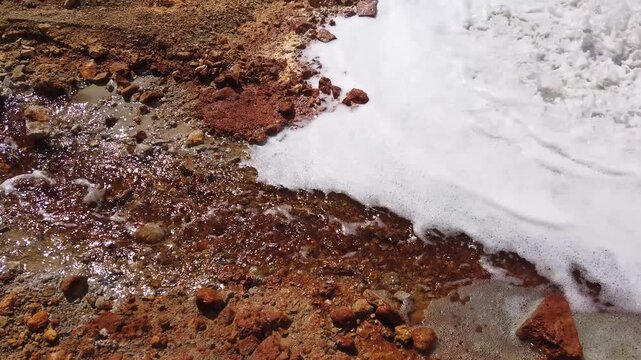  Toxic gold mining residual waters from gold mine flowing and polluting environment. Rosia Montana, Romania