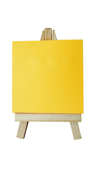 Yellow sticky post note paper on a stand isolated transparent background png.