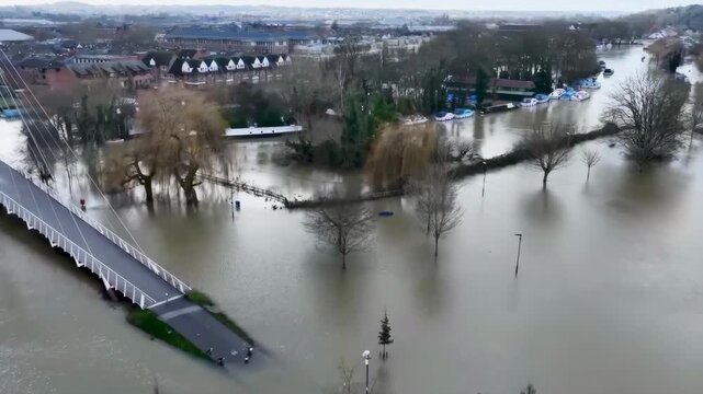 Aerial view of a flooded city and a flooded bridge in uk.
