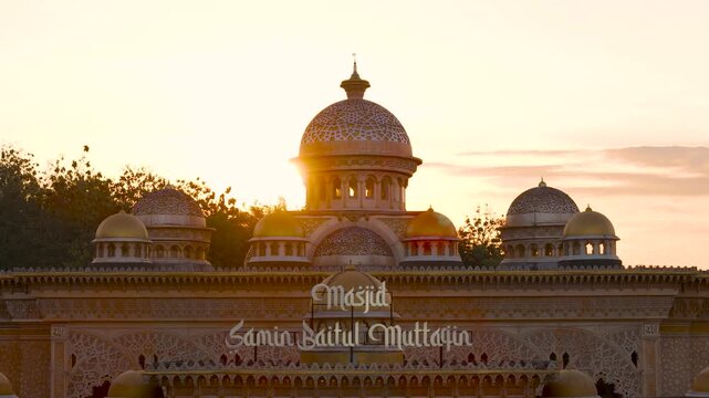 Aerial view of the ornate domes of Masjid Samin Baitul Muttaqin during sunset in Bojonegoro, East Java, Indonesia.
