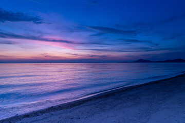 Fototapeta premium Twilight seascape with a delicate sky gradient at Ariake Beach in Kagawa Prefecture, Japan.