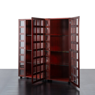 A 1970s bookcase with glass and wood doors. The doors are open and offer a view inside.