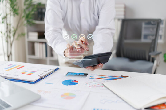 Financial Businesswomen analyze the graph of the company's performance to create profits and growth, Market research reports and income statistics, Financial and Accounting concept.