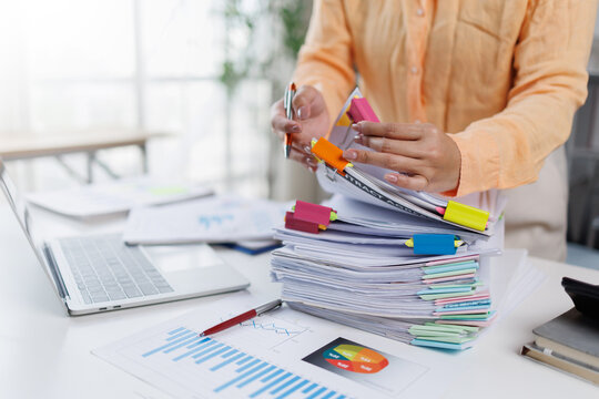 Business Documents, Auditor businesswoman checking searching document legal prepare paperwork or report for analysis TAX time,accountant Documents data contract partner deal in workplace office