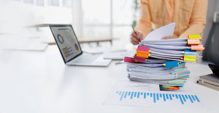 Businesswoman or accountant conducting an analysis of financial reports on a laptop, emphasizing the utilization of digital tools for data interpretation and informed decision-making.