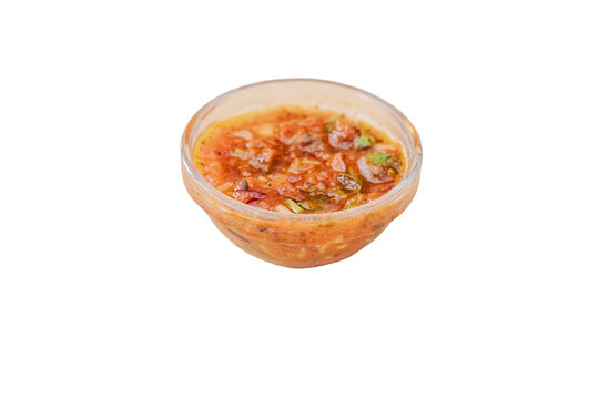 Spicy tomato salsa dip in glass bowl