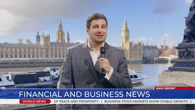 Caucasian Male Reporter Speaks Into a Handheld Microphone While Presenting Financial and Business News Outdoors by the Thames, With Westminster Palace and Big Ben Glowing Behind Him