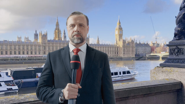 TV Correspondent Delivers a Live Political Update, Speaking Into Microphone. 