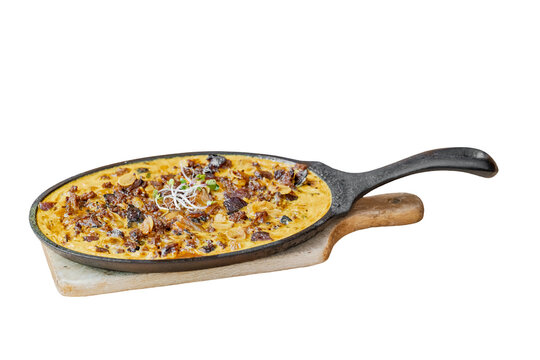 Savory frittata dish serving breakfast in cast iron skillet