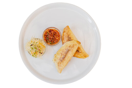 Delicious latin american empanadas with salsa and side salad