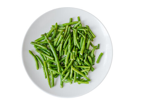 Green beans on white plate prepared for healthy meal