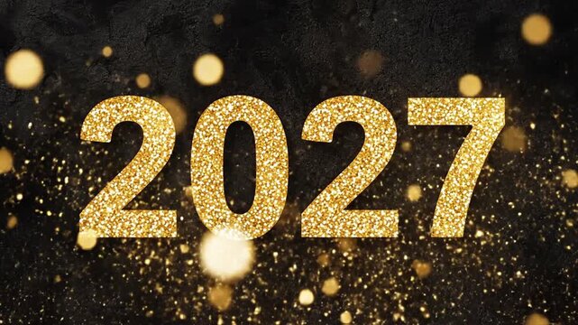 Golden glittering 2027 year numbers on dark stone background