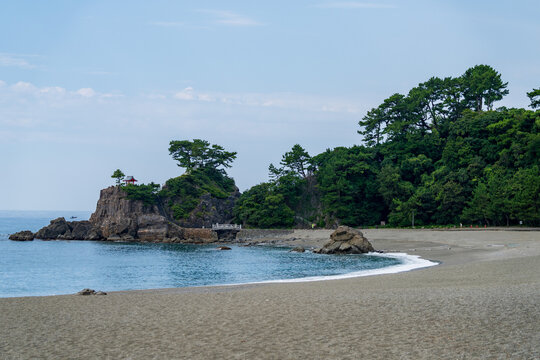 View of Kaizumi Shrine (Ryuo Shrine) perched on Ryuzu Cape at Katsurahama in Kochi, Japan.