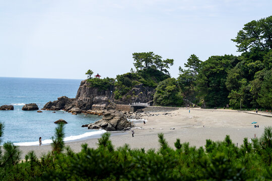 View of Kaizumi Shrine (Ryuo Shrine) perched on Ryuzu Cape at Katsurahama in Kochi, Japan.