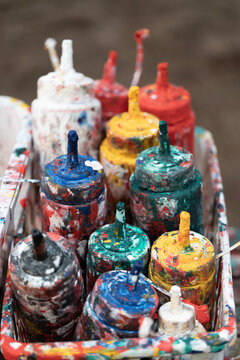 Old color bottle with splatter paints