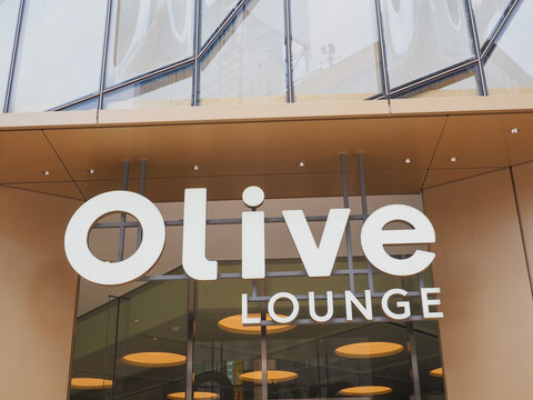 TOKYO, JAPAN - July 31, 2026: An Olive Lounge sign on a building, Seibu department store, in Tokyo's Shibuya area.