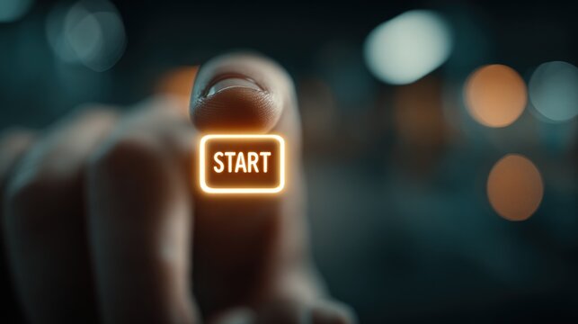 Someone is pressing a button with a glowing start sign