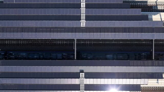Aerial view of a train passing through the modern station in Delft, South Holland, Netherlands.