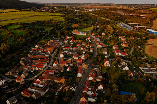 Aerial drone view of the traditional rural German village Gorndorf with red roofs at sunset