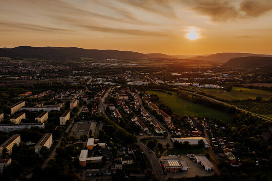 Aerial view of a German town at sunset with a dramatic cloudy sky