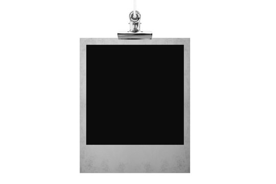 Blank photo frame hanging on a rope with a metal clip clothespin. Isolated transparent PNG mockup.
