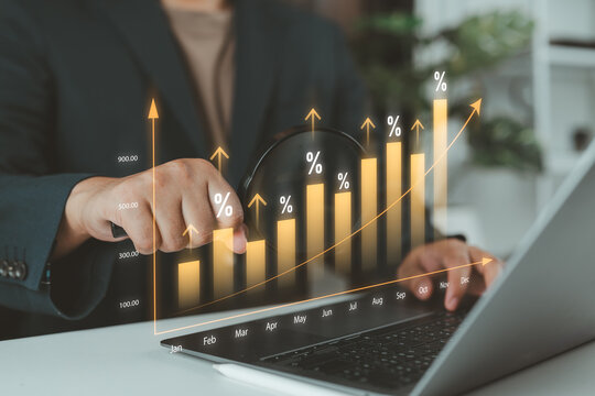 Business professional analyzing a rising financial chart with a magnifying glass, representing data analytics, market growth, investment performance, economic trends, and strategic decision-making