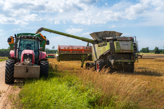 CLAAS Lexion 770 Combine Unloading Grain into a Tractor Trailer During Harvest in Jērcēni, Latvia &ndash; August 10, 2026