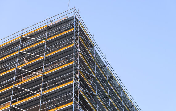 Scaffolding structure covering building during renovation work
