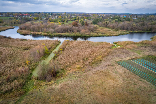 Aerial view of rural Ros river landscape with farmland, Ukraine.