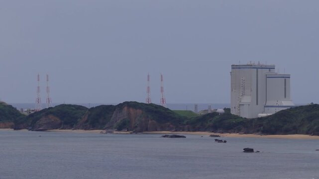 Empty launchpad and beach at island space facility on sunny day