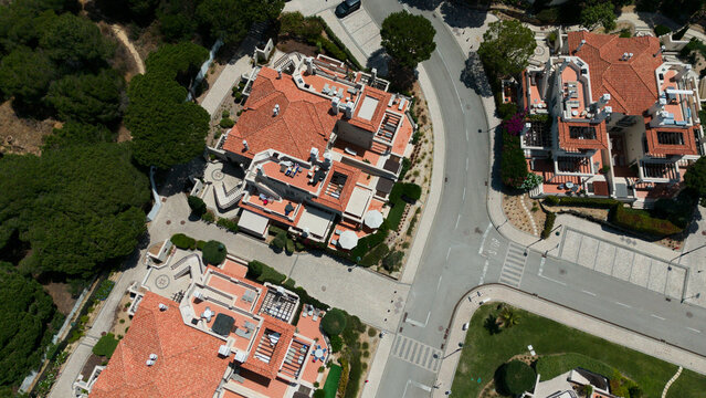 Aerial drone footage, shooting the tourist village of Vale de Lobo, on the shores of the Atlantic Ocean, golf courses for tourists. Portugal, Algarve.