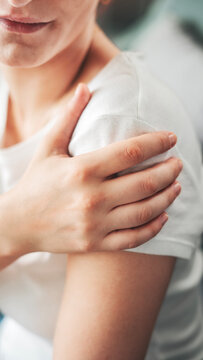 Young woman suffering from arm pain