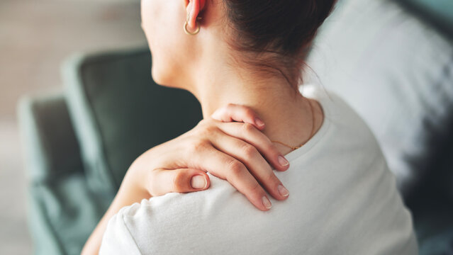 Young woman suffering from nape pain