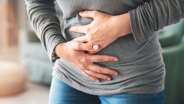 Young woman with stomach ache