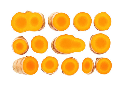 Fresh turmeric root slices and whole pieces, vibrant orange color, ideal for culinary and medicinal use in food.
