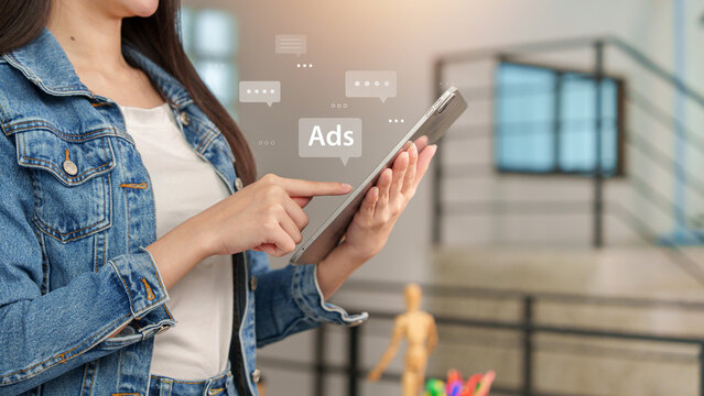 Woman using digital tablet for online advertising and target marketing campaign