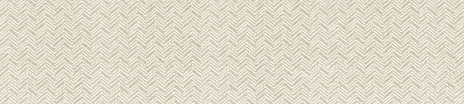 Beige and white herringbone fabric texture showcasing a subtle woven chevron design