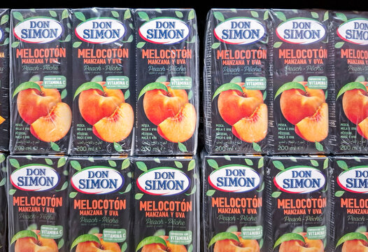 Denia, Spain - October 16, 2025.Don Simon brand peach, apple, and grape juice boxes on display in a store in Spain