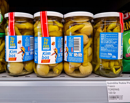 Denia, Spain - October 16, 2025.Glass jars of Toreras brand Kimbos spicy pickled peppers with olives on shelf in Spanish supermarket