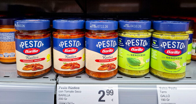 Denia, Spain - October 16, 2025.Barilla pesto jars on a shelf in a Spanish supermarket