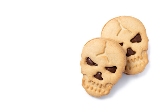 Halloween skull cookies with chocolate isolated on white background. Copy space
